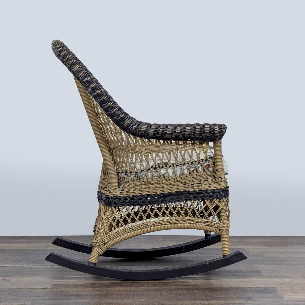 2. Side angle of a Reperch wicker lounge rocking chair, featuring dual-tone weave and cushioned seat.
