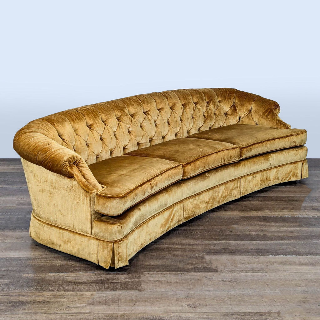 3. Angled view of Reperch 3-seat gold velour sofa displaying button-tufting, three cushions, and curved front.