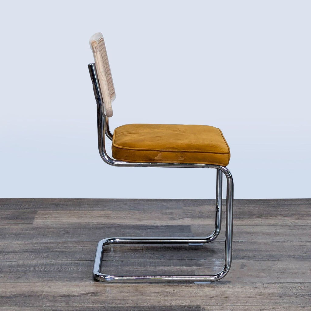 3. Side view of Reperch cantilever dining chair showing chrome frame and cushioned velvet seat.