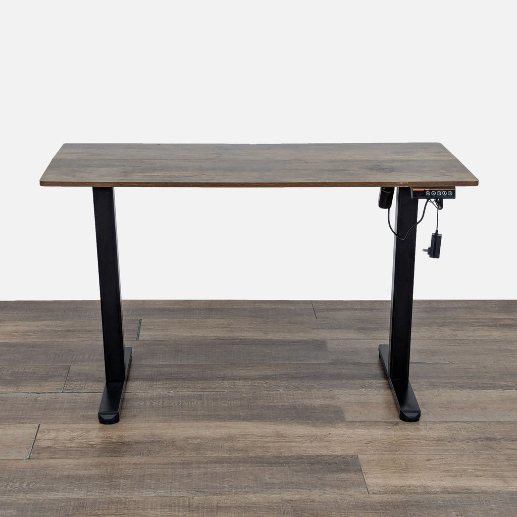 Reperch desk with black frame, wood finish, and electronic controller with 3 memory presets, front view.