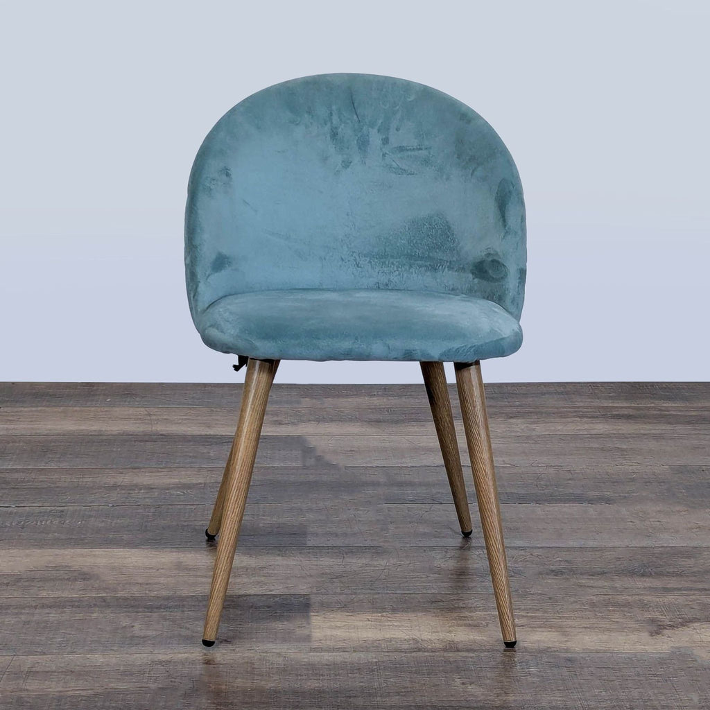Single George Oliver dining chair in blue velvet with rounded backrest and metal legs, viewed from the front.