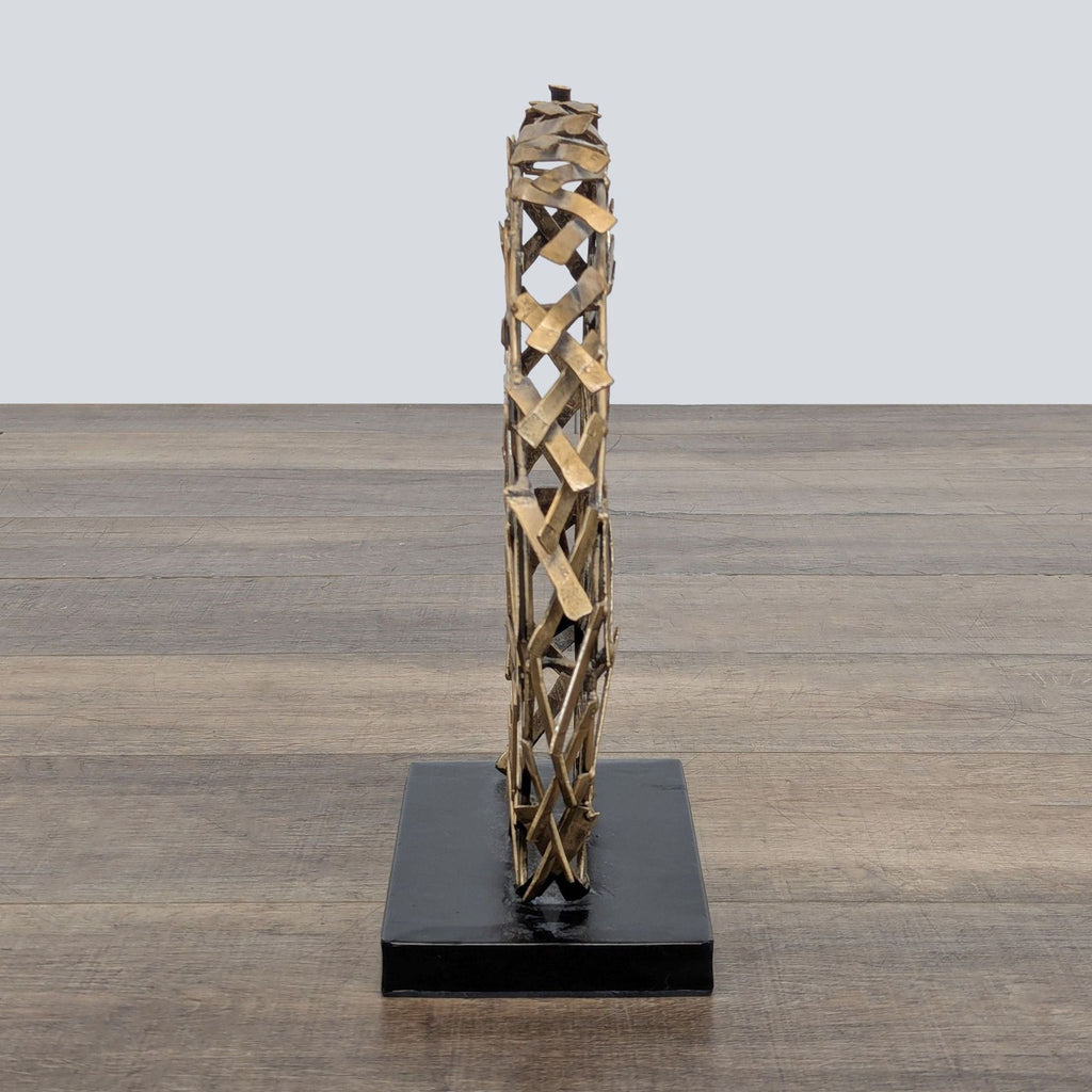 3. Side profile view of the sculpted wild stallion head in antiqued goldtone metal on a black base, Ashley Furniture.