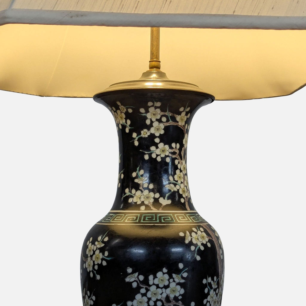 2. Close-up of porcelain lamp base with detailed white floral design and brass hardware, lit fabric shade above.  