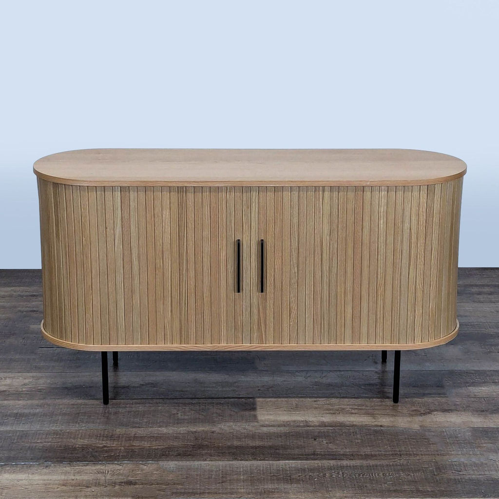 3. Mid-century AllModern TV stand with kiln-dried wood, solid oak finish, black legs, and curved silhouette, closed view.