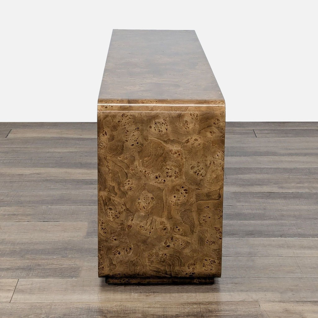 3. Side view of the Restoration Hardware entertainment center, showcasing its smooth, waterfall-cornered mappa burl finish.