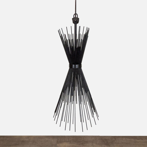 1. Modern black metal chandelier with radiating rods in an hourglass shape, suspended from the ceiling.