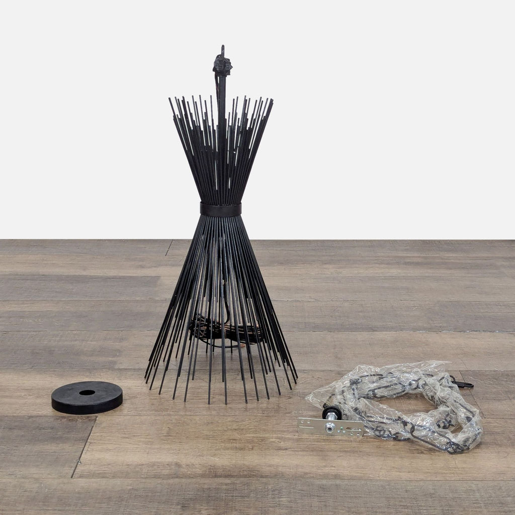 3. Visual Comfort lighting chandelier, hourglass form with metal rods, laid out with installation parts on floor.