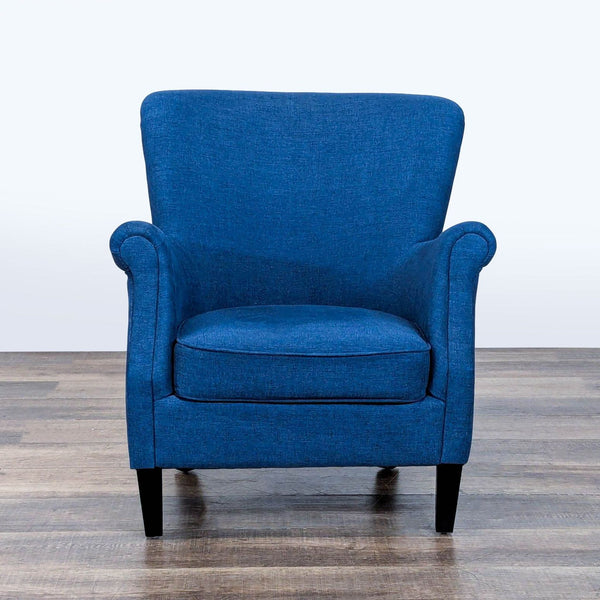 1. Front view of a Pottery Barn lounge chair with heathered blue fabric, rolled arms, and wood legs.