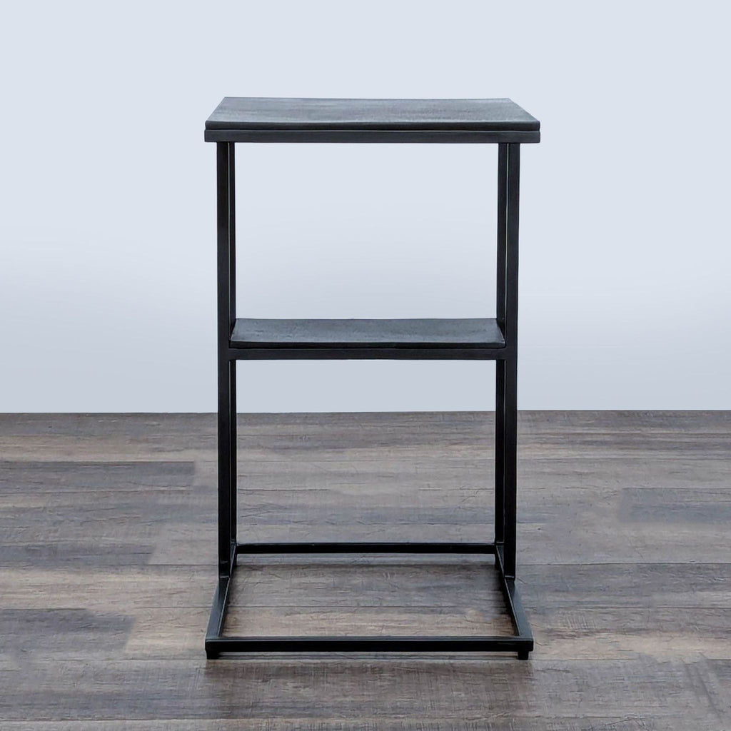 2. Geometric console table with an open base, oil-bronze finish, fits Side & Console Table category.