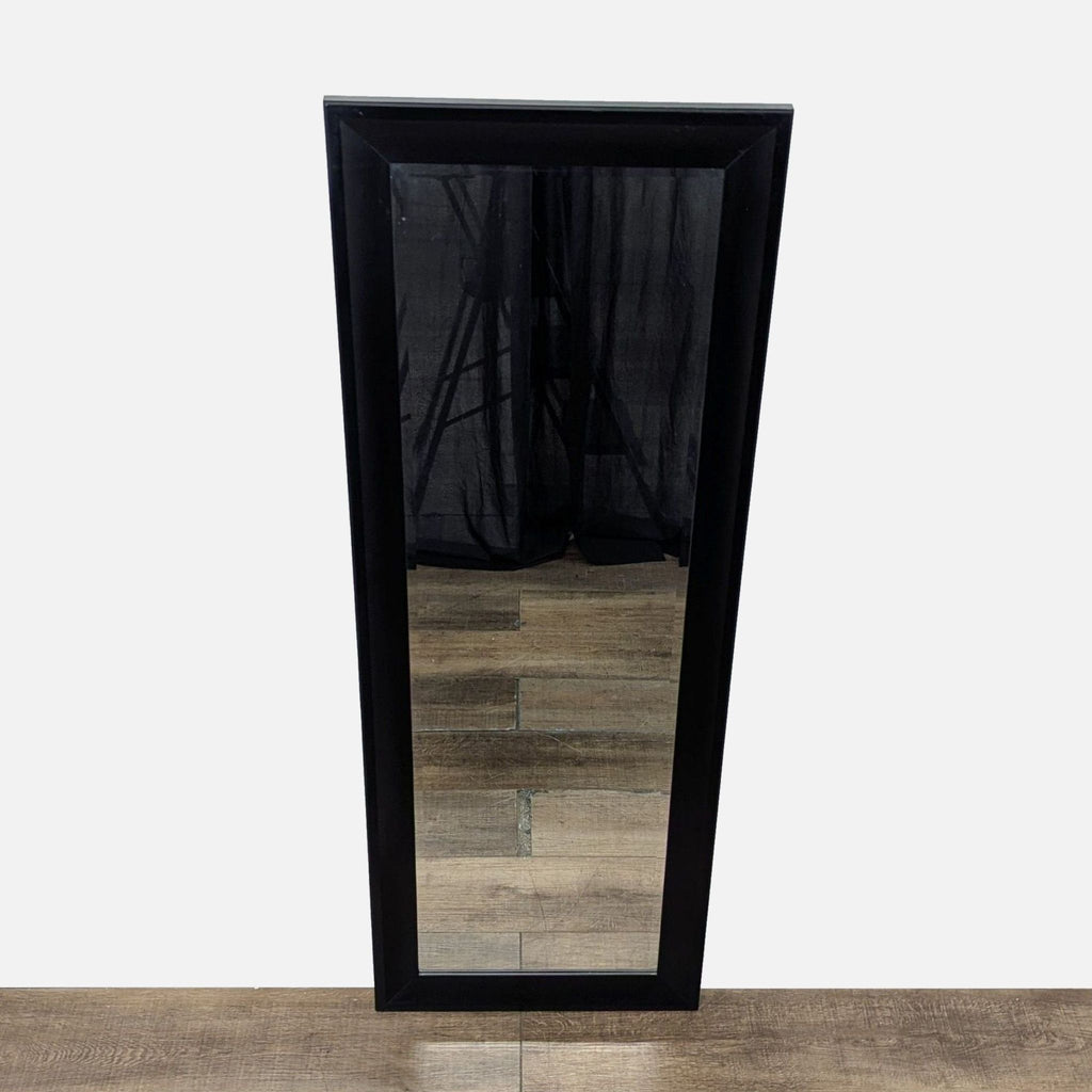 1. Full-length Target mirror with a black rectangular frame, standing on a wooden floor in front of curtains.  