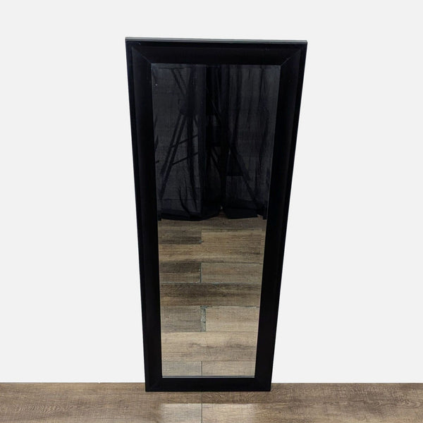 1. Full-length Target mirror with a black rectangular frame, standing on a wooden floor in front of curtains.  