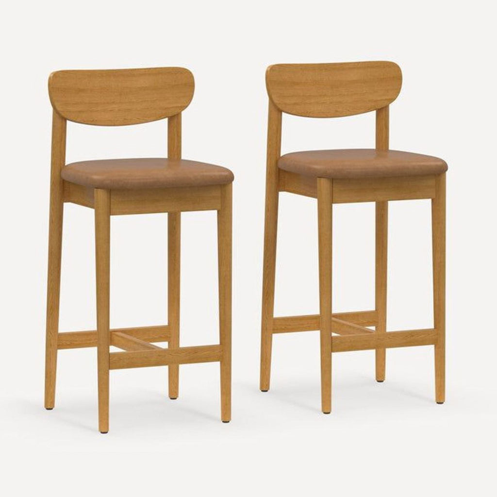 Pair of Burrow stools with hardwood frames and upholstered seats, shown in a light wood finish.  