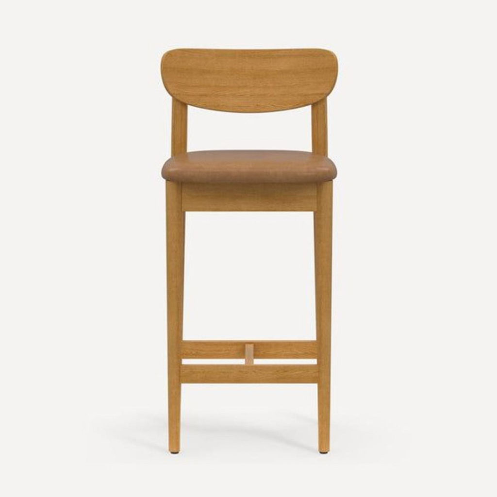 Front view of a Burrow hardwood stool with a rounded backrest and an upholstered seat.