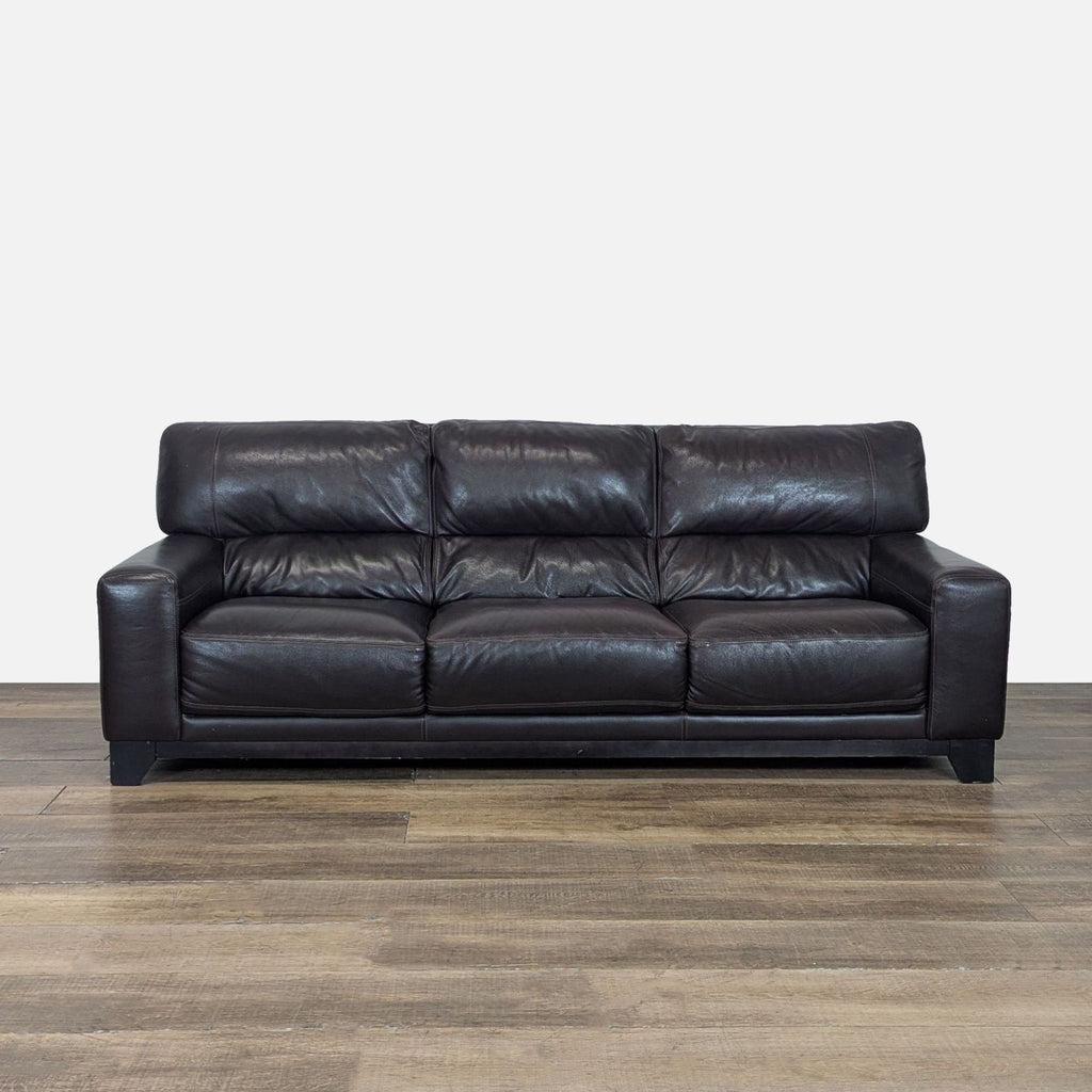 1. Front view of a Reperch 3-seat sofa with dark brown leather, plush cushions, and wood block feet.