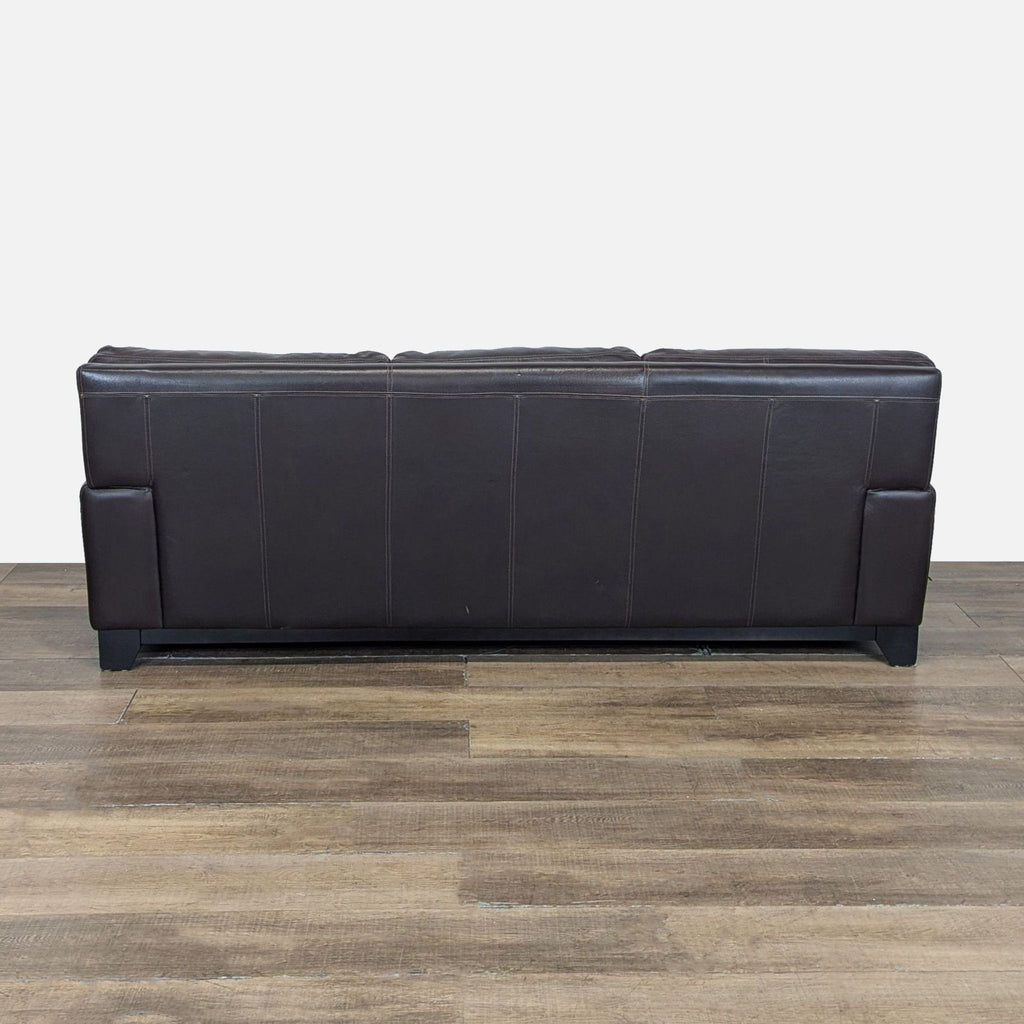 3. Back view of the Reperch 3-seat sofa, highlighting the dark brown leather and stitched panels.