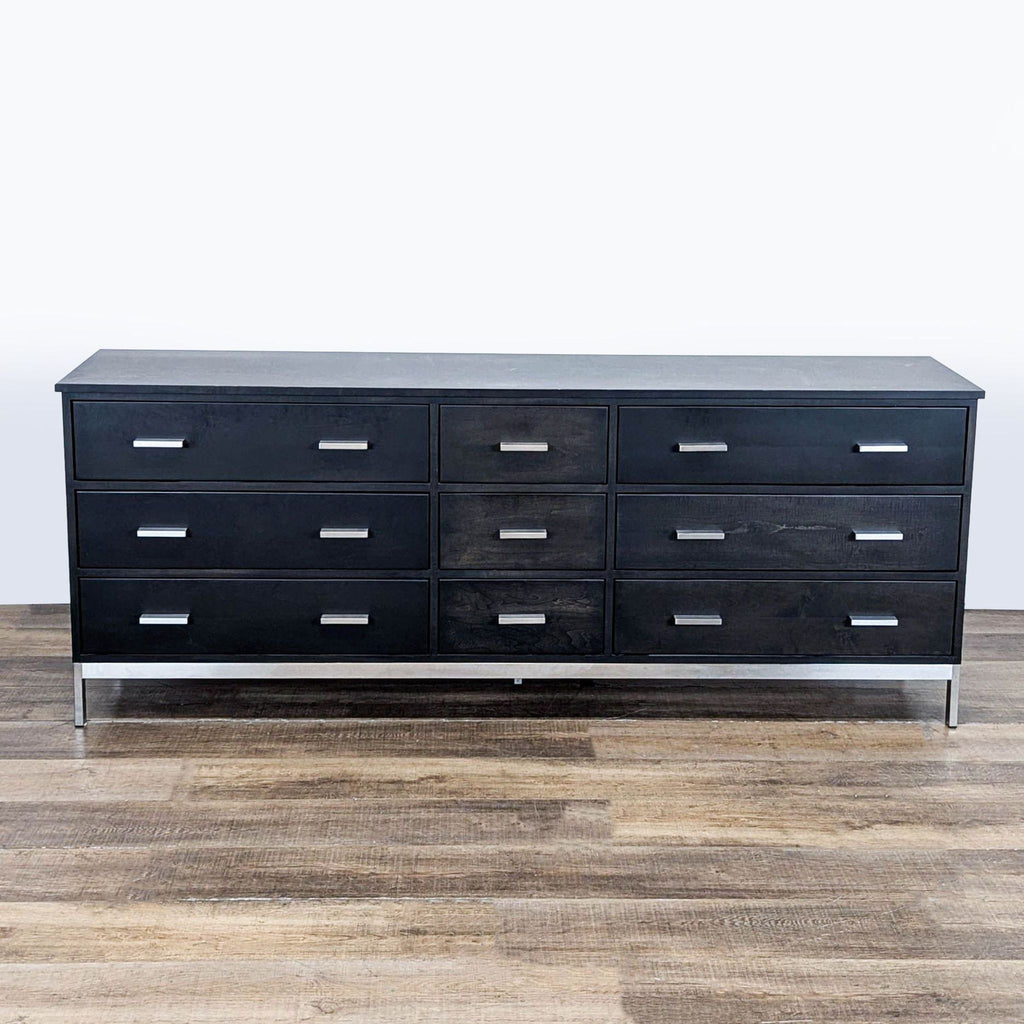 3. Modern charcoal-stained maple dresser by Room and Board, with metal details and clean lines, all drawers closed.