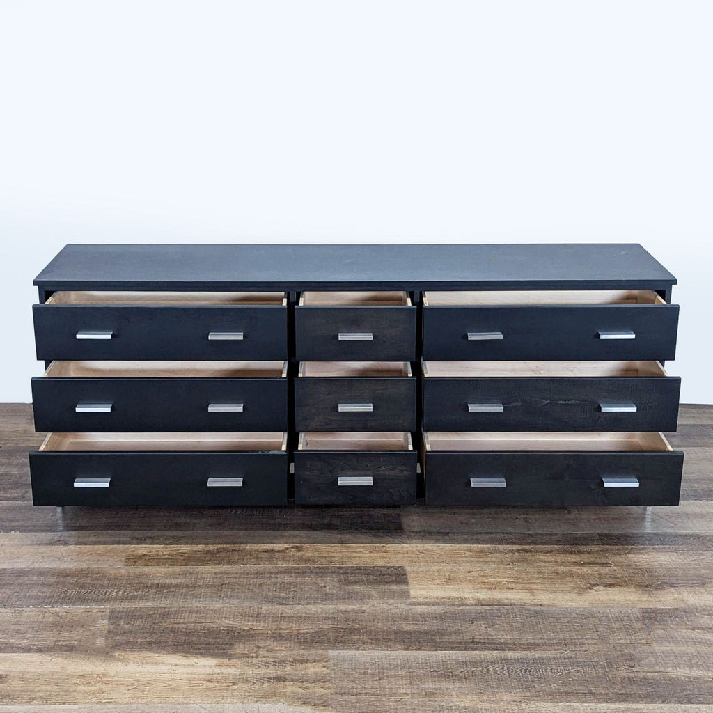 2. Room and Board charcoal maple dresser featuring metal slab pulls and base, all drawers open for interior view.