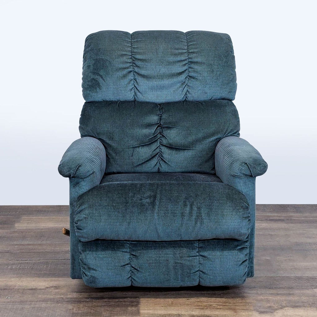 1. Front view of a La-Z-Boy manual recliner with plush blue upholstery on a wooden floor.