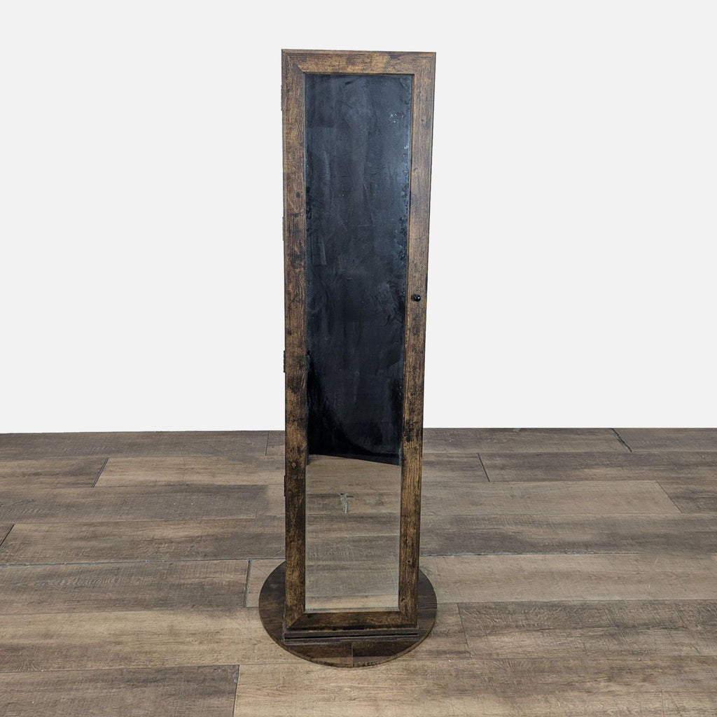 2. Front view of Ameziel rustic swivel jewelry armoire, featuring a full-length mirror panel.  