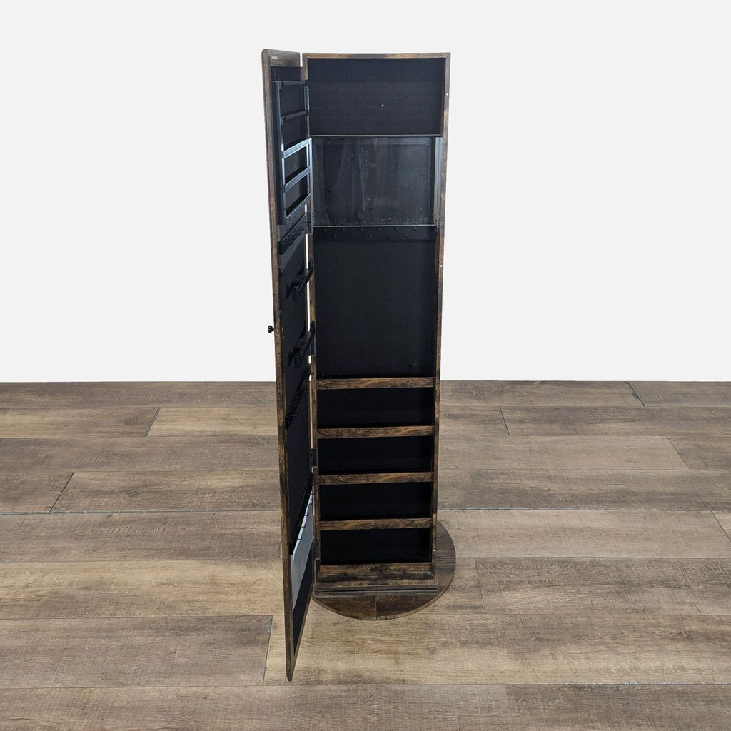 3. Swivel jewelry armoire by Ameziel shown open, revealing internal shelving and jewelry storage space.