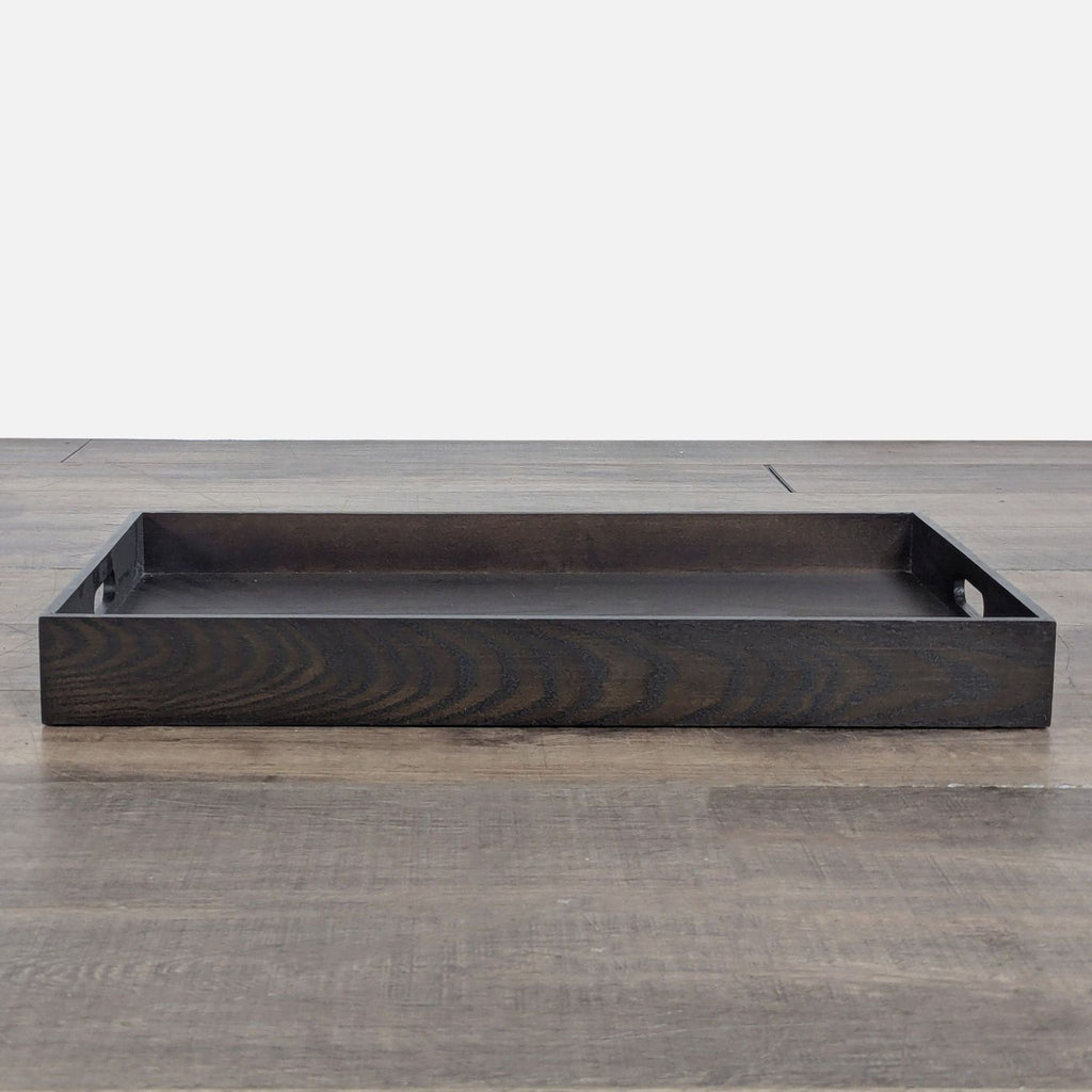 3. Side view of a dark wood West Elm tray from the Other category, highlighting its simple rectangular design.