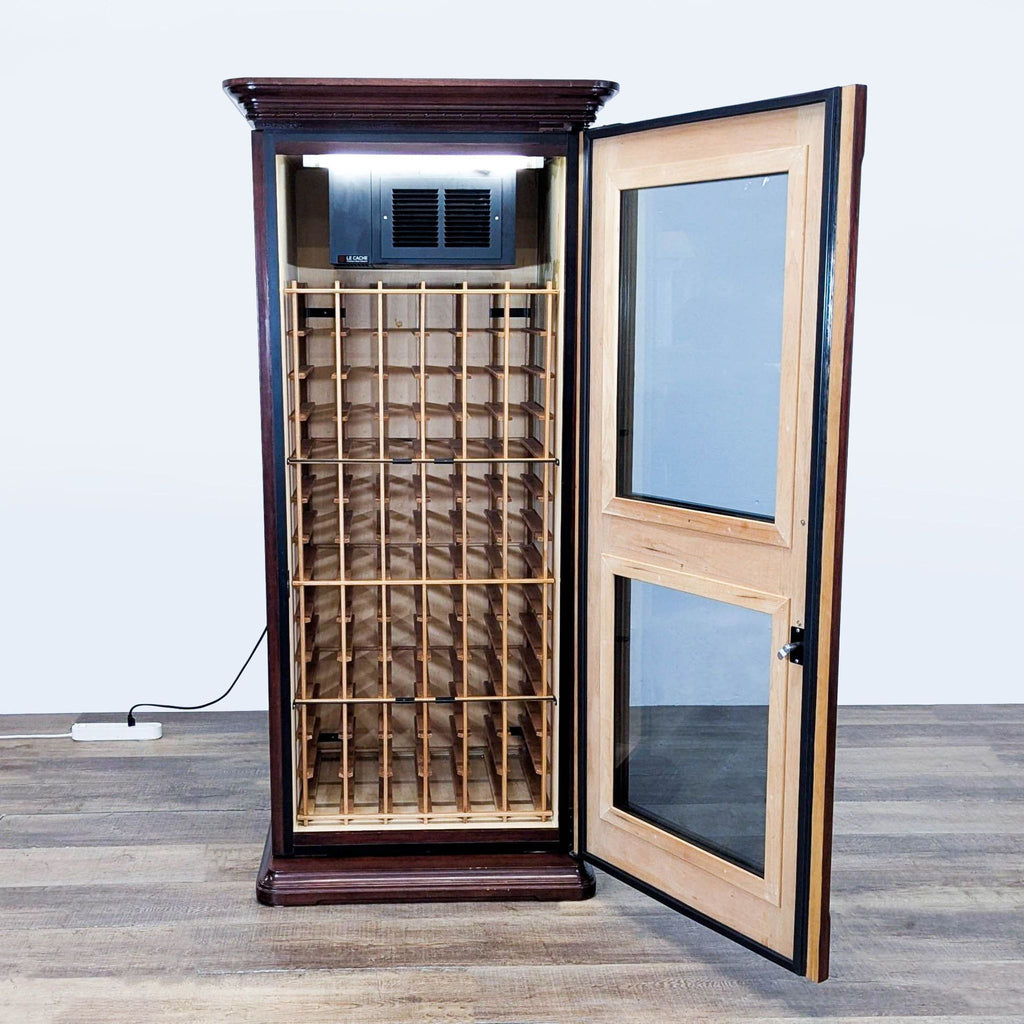 2. Interior view of Le Cache wine refrigerator, showing cedar racks and integrated cooling system for bottles.