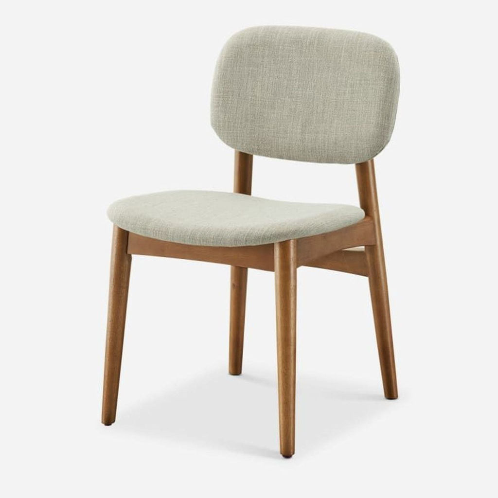 3. Castlery dining chair, angled view, with fabric upholstered bent wood seat and back, plus sturdy rubber wood legs.
