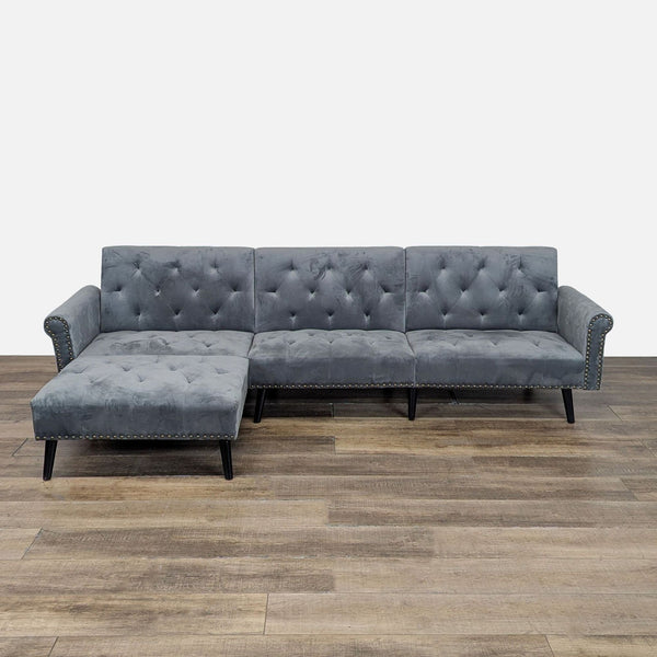 1. Gray tufted sectional sofa by Veryke with rolled arms, nailhead trim, sleeper function, and moveable ottoman.