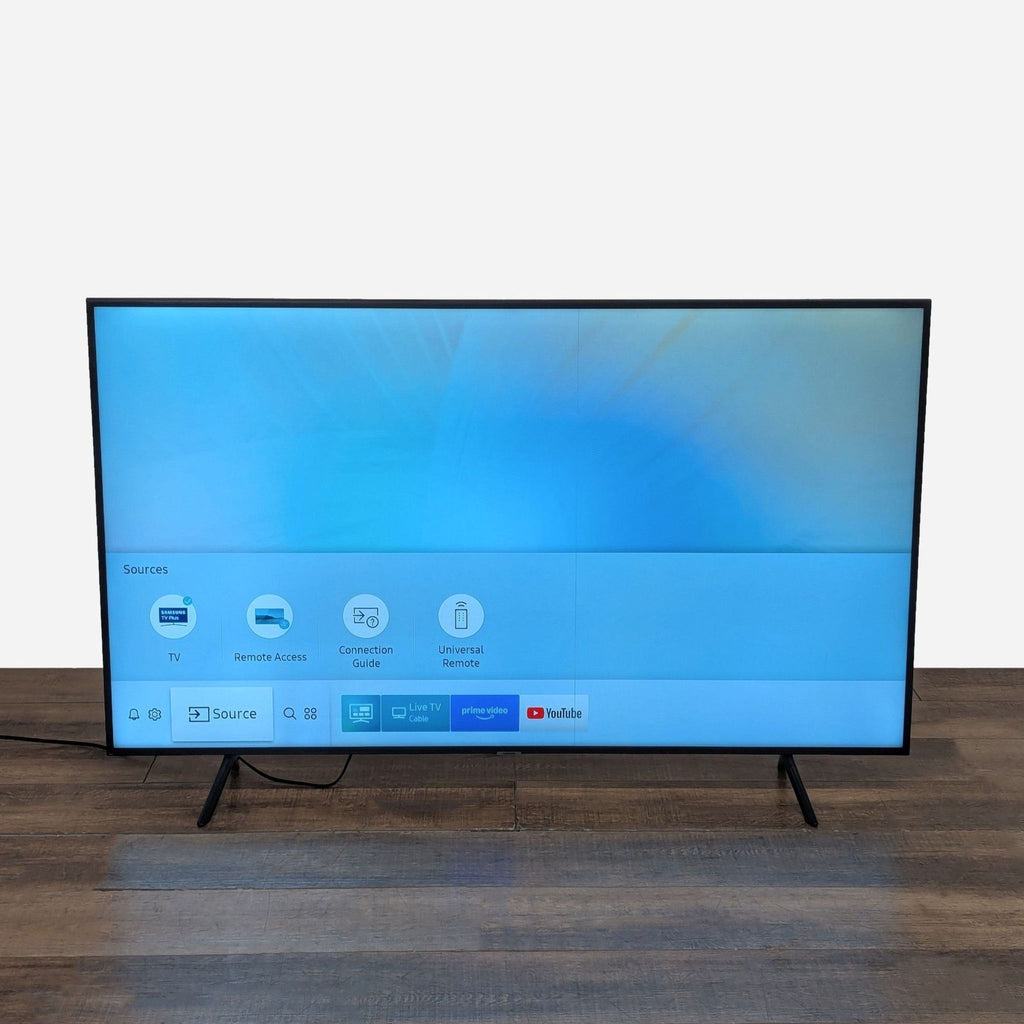 2. Samsung Smart TV showing home screen interface, highlighting easy access to streaming apps and settings.