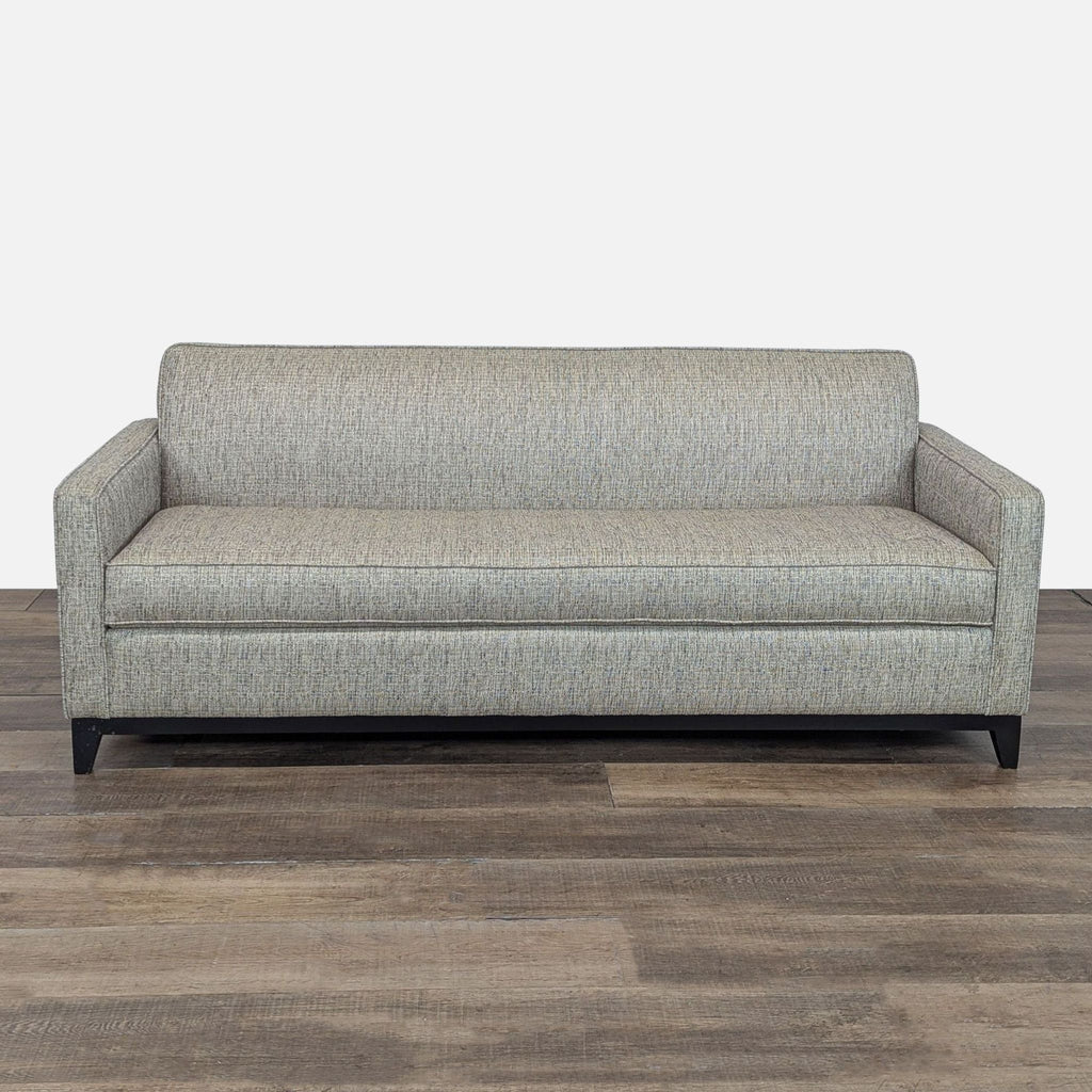 1. Apt2B sleeper sofa with button-tufted cushions, tight back, and solid wood base in a modern neutral fabric.