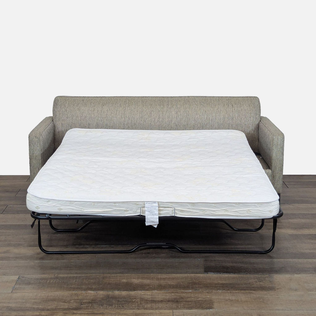 2. Queen-sized pull-out sleeper mattress extended from Apt2B sofa, showing spacious and practical design.