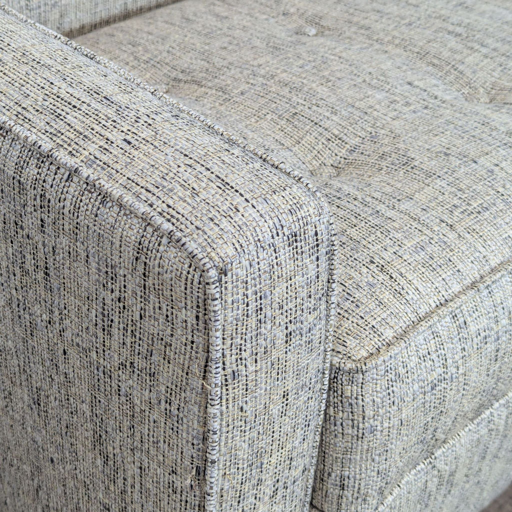 3. Close-up of Apt2B sleeper sofa's textured upholstery, highlighting the fabric and fine stitching details.