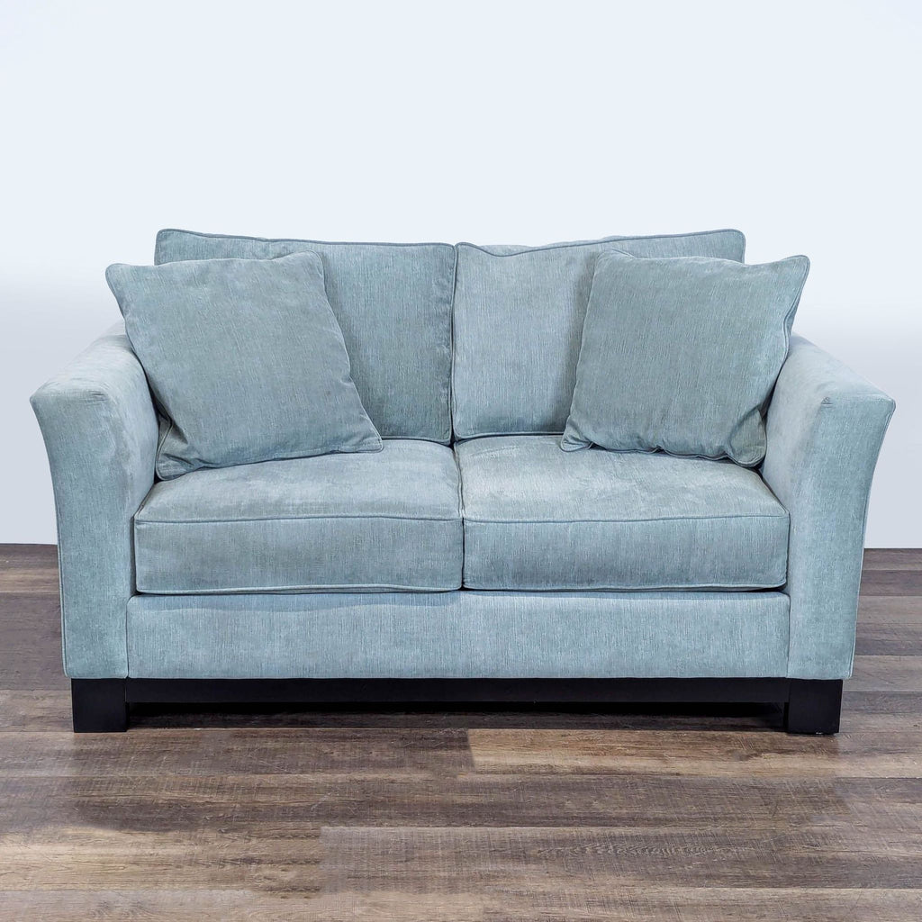1. Jonathan Louis loveseat with gently flared arms, loose cushions, and dark wood base, front view.  