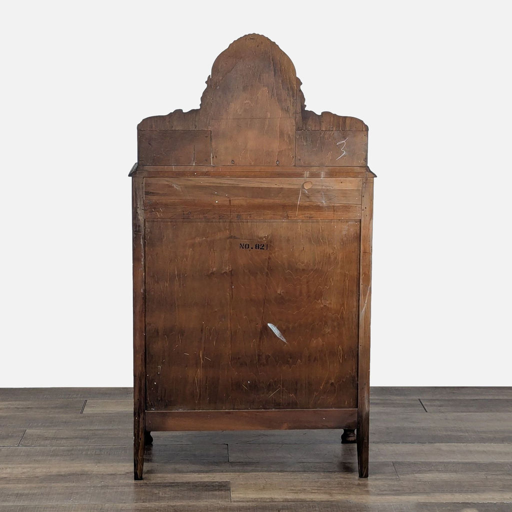 Rear view of the Reperch dresser showing solid wood backing and the top's carved silhouette.