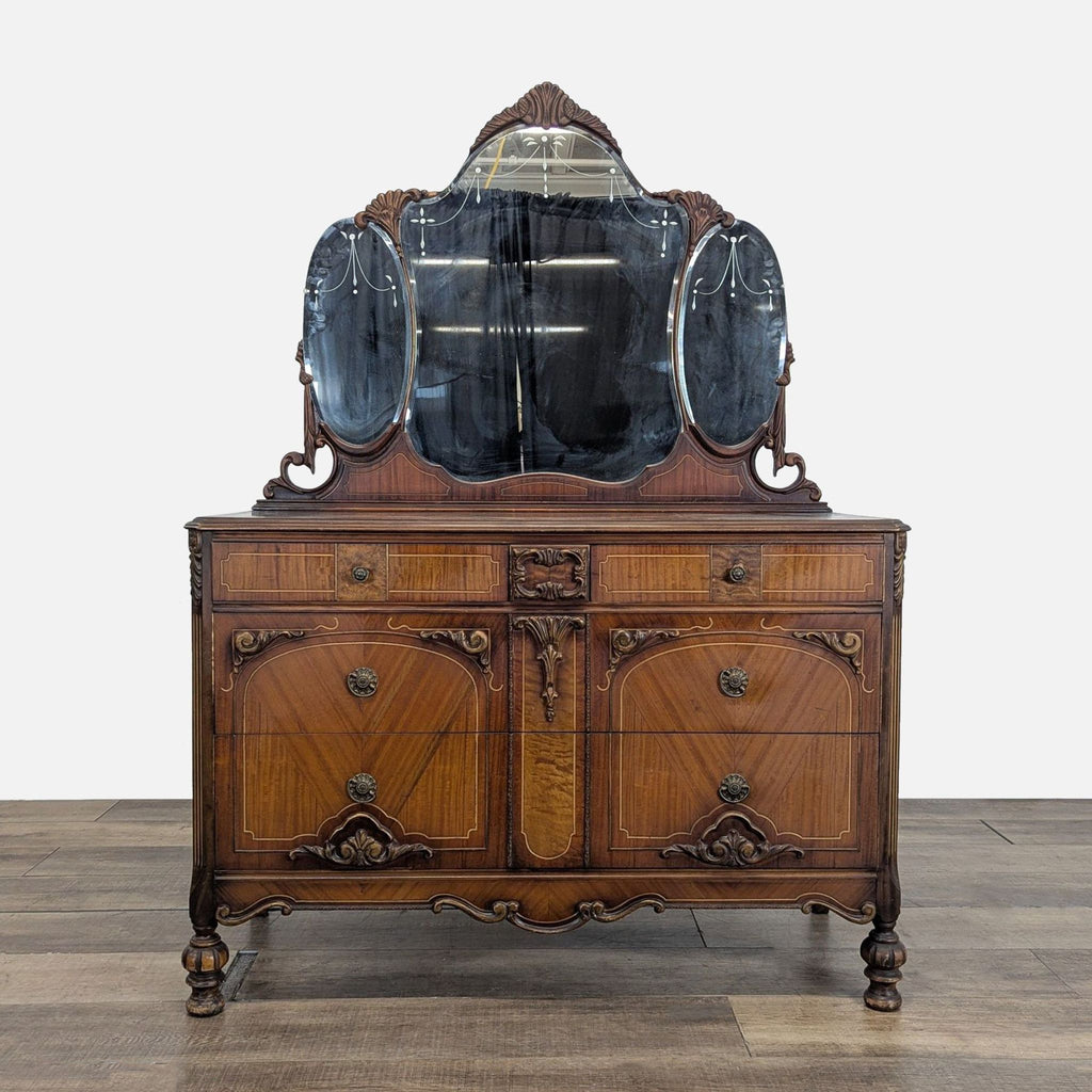 1. Antique Reperch dresser with ornate wood, six drawers, and a three-panel mirror in elegant style.