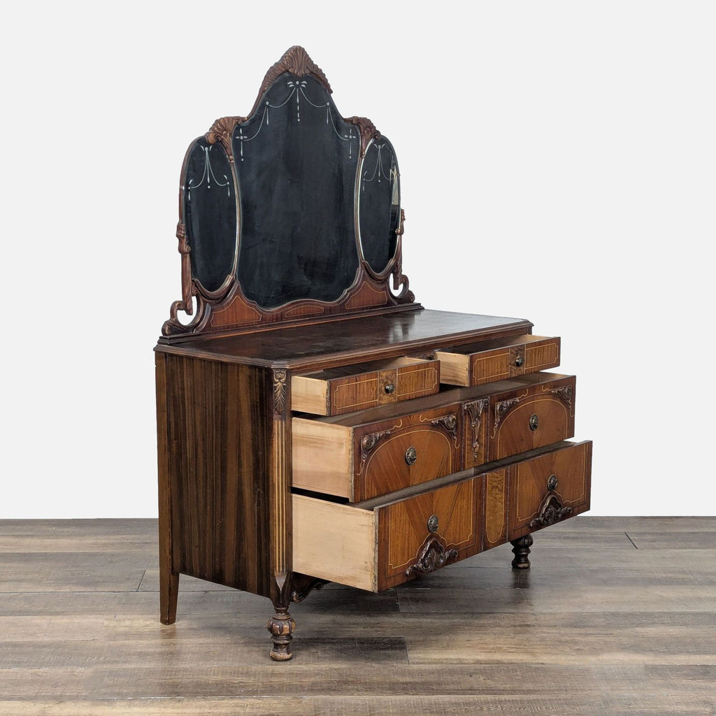 2. Side view of vintage six-drawer Reperch dresser, showing opened drawers and decorative mirror panels.
