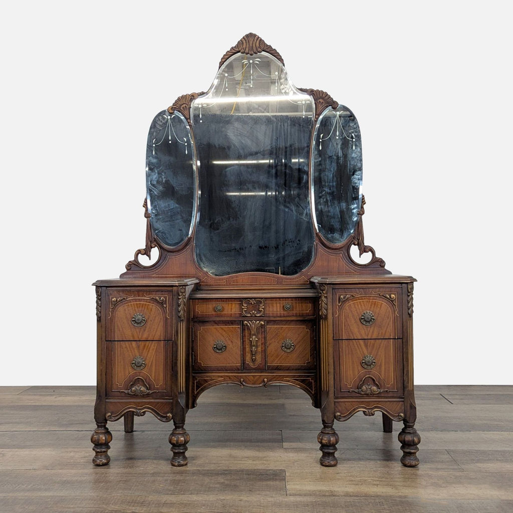 1. Antique Reperch vanity dresser with ornate woodwork, five drawers, and a three-panel mirror, front view.  