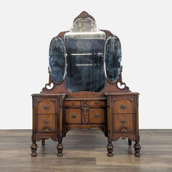 1. Antique Reperch vanity dresser with ornate woodwork, five drawers, and a three-panel mirror, front view.  