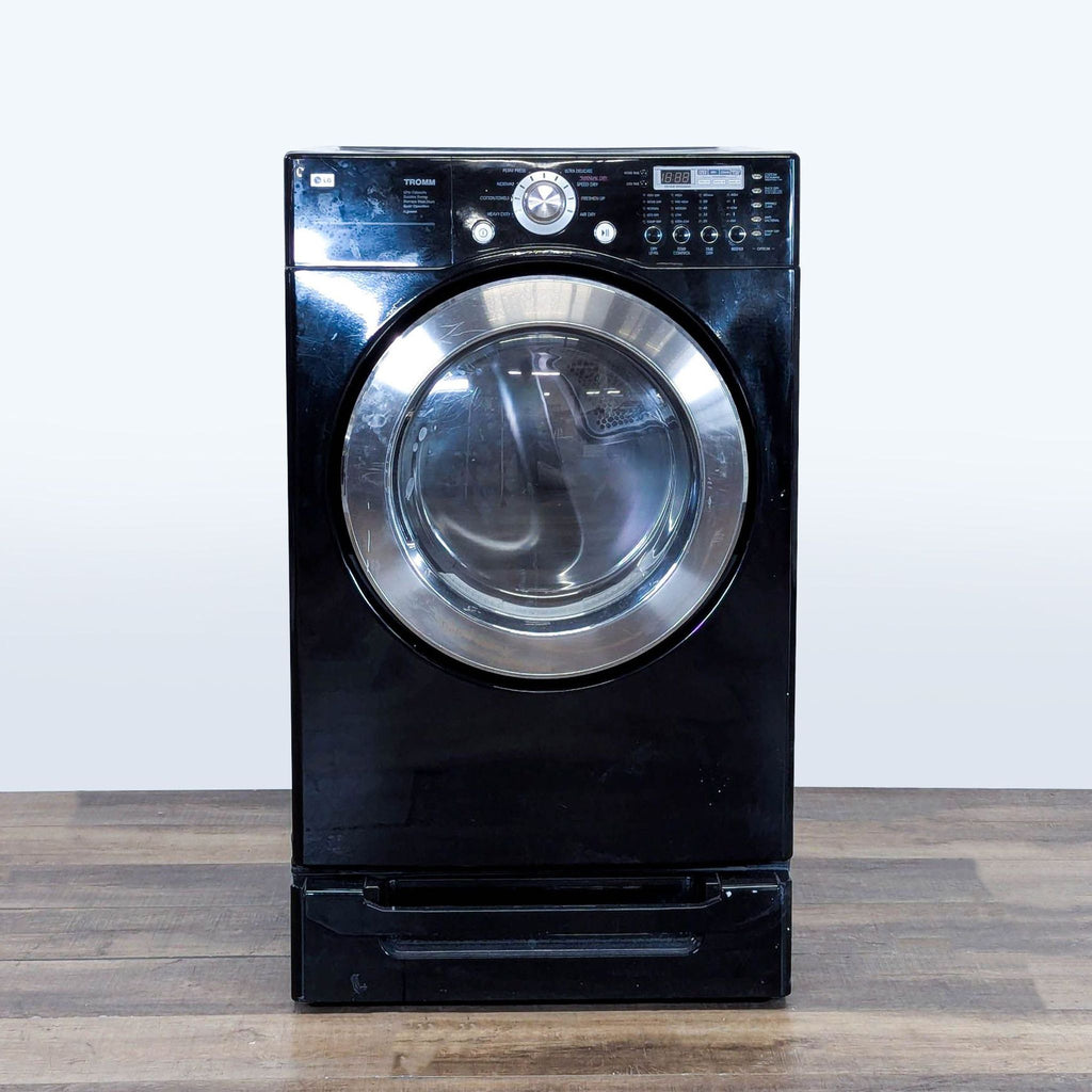 1. Front view of a black LG Inverter Direct Drive Washer with a closed door, category Washer/Dryer.