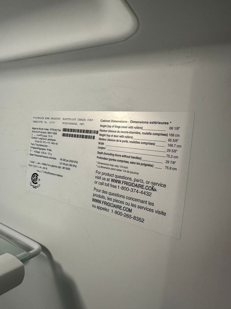 1. Frigidaire refrigerator with sleek exterior, for kitchen appliance category.