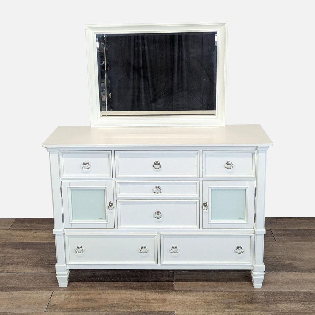1. White Ashley dresser with seven drawers, two frosted glass cabinets, and a matching mirror on top.