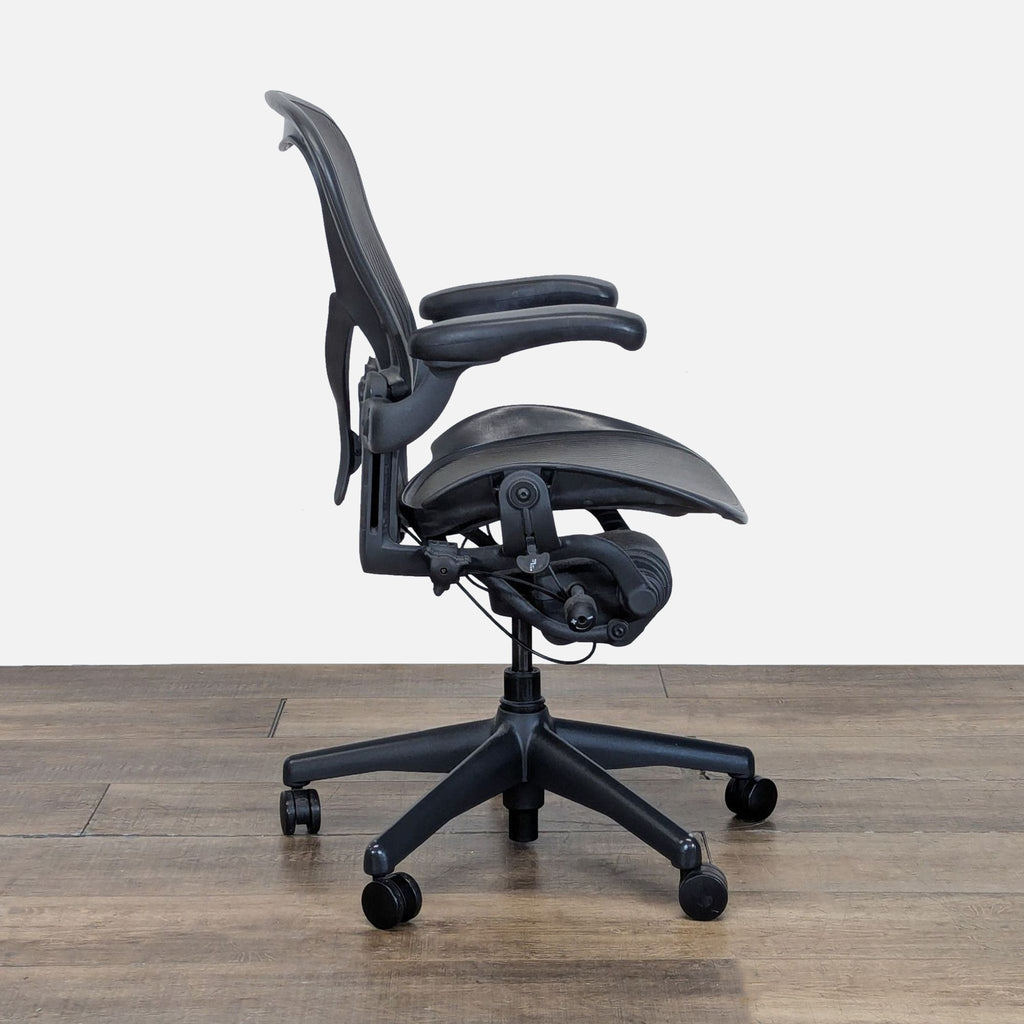 2. Side profile of the Herman Miller ergonomic chair with adjustable armrests and Harmonic 2 Tilt mechanism.  