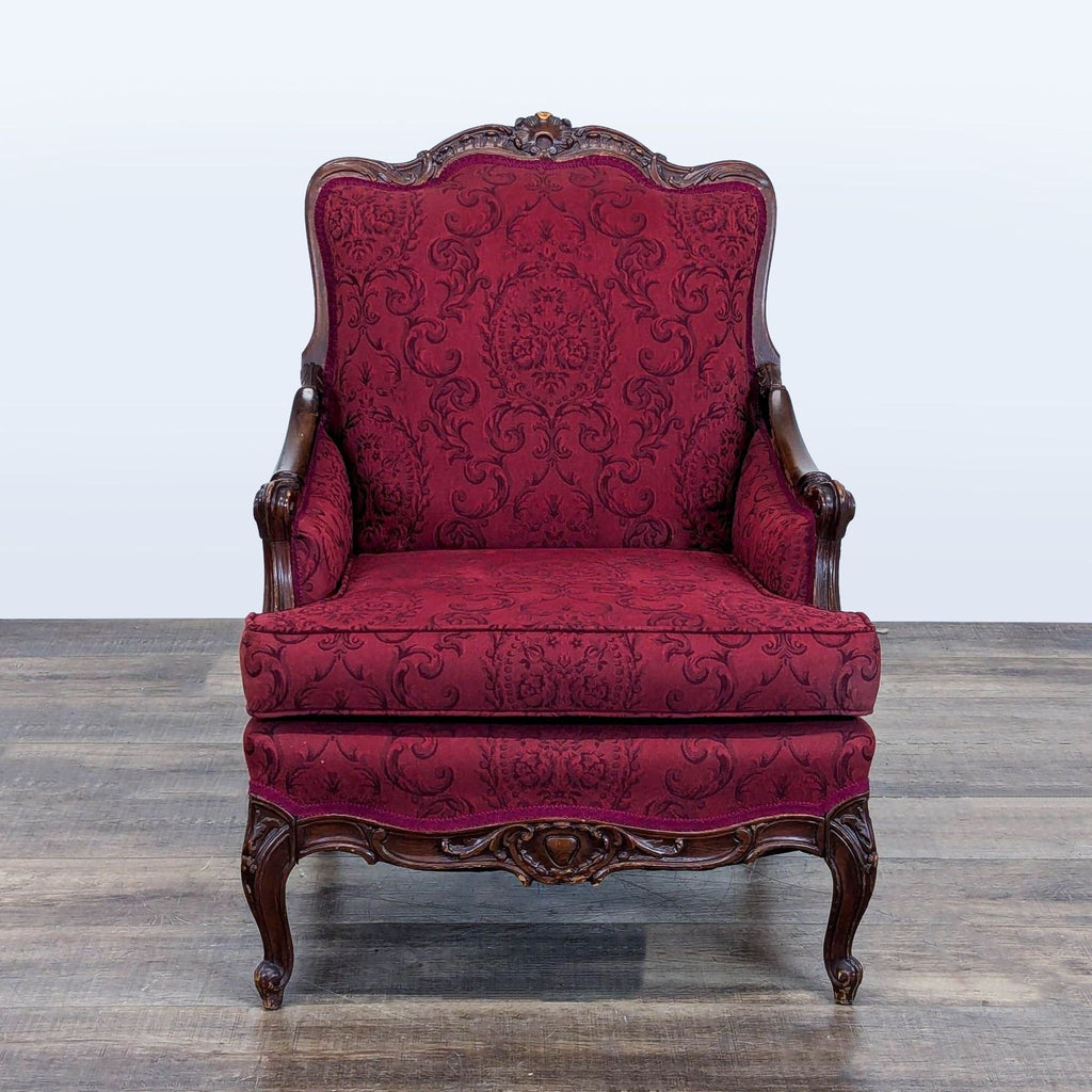 1. Reperch lounge chair with ornate wooden frame, cabriole legs, and burgundy damask baroque upholstery, front view.