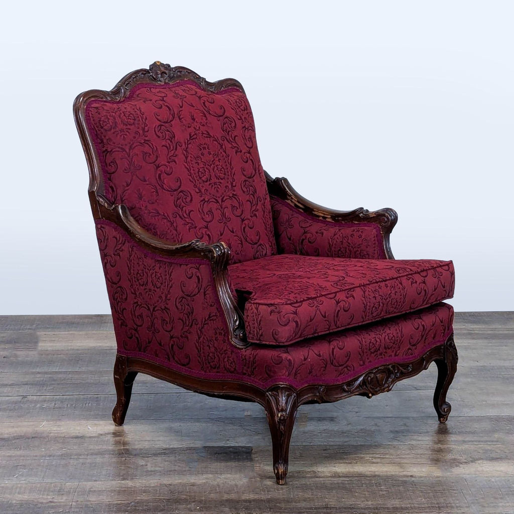 3. Angled view of Reperch lounge chair, carved wood details, cabriole legs, and rich burgundy baroque upholstery.