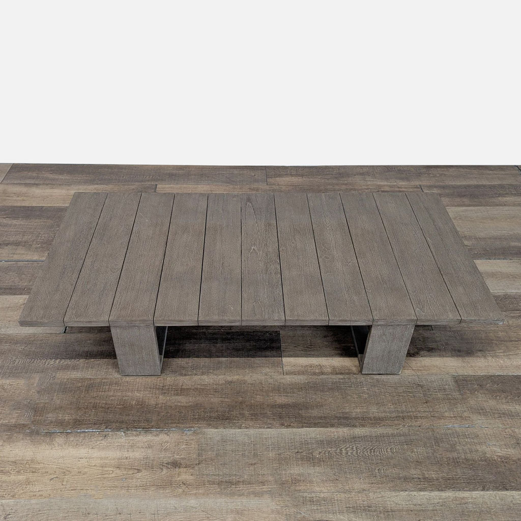 2. Overhead view of a rectangular weathered teak table from Restoration Hardware, with a slatted surface.  