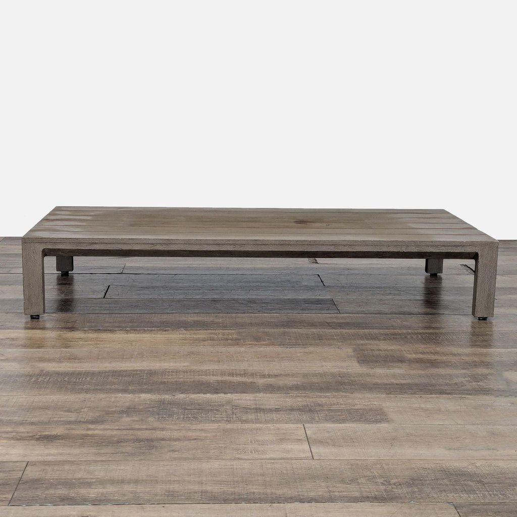 1. Low-profile slatted table made of weathered teak, from Restoration Hardware, shown on a wood floor.