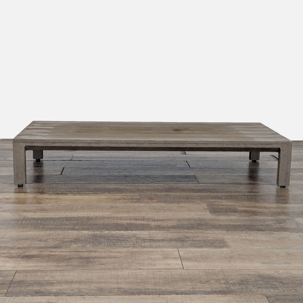 1. Low-profile slatted table made of weathered teak, from Restoration Hardware, shown on a wood floor.