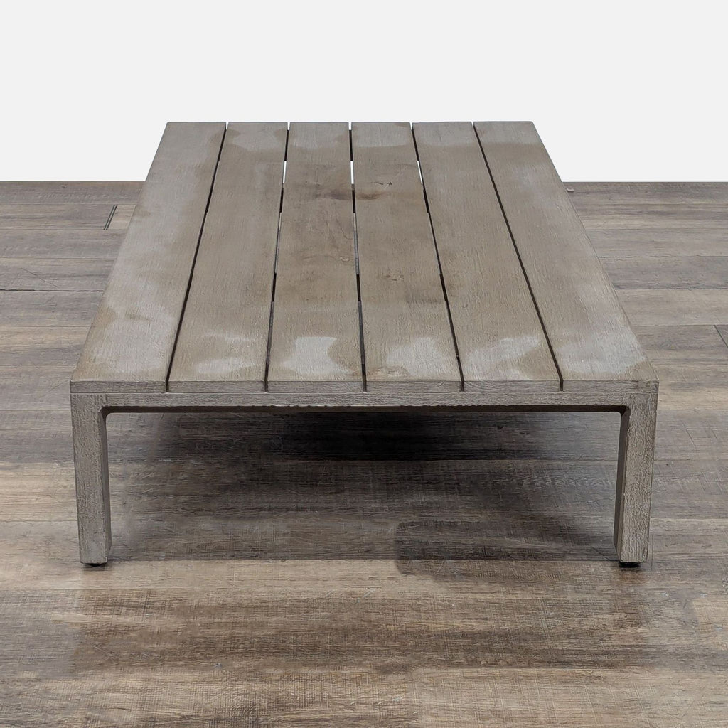 2. Rectangular weathered teak table with slatted top and minimal legs, Restoration Hardware table category.
