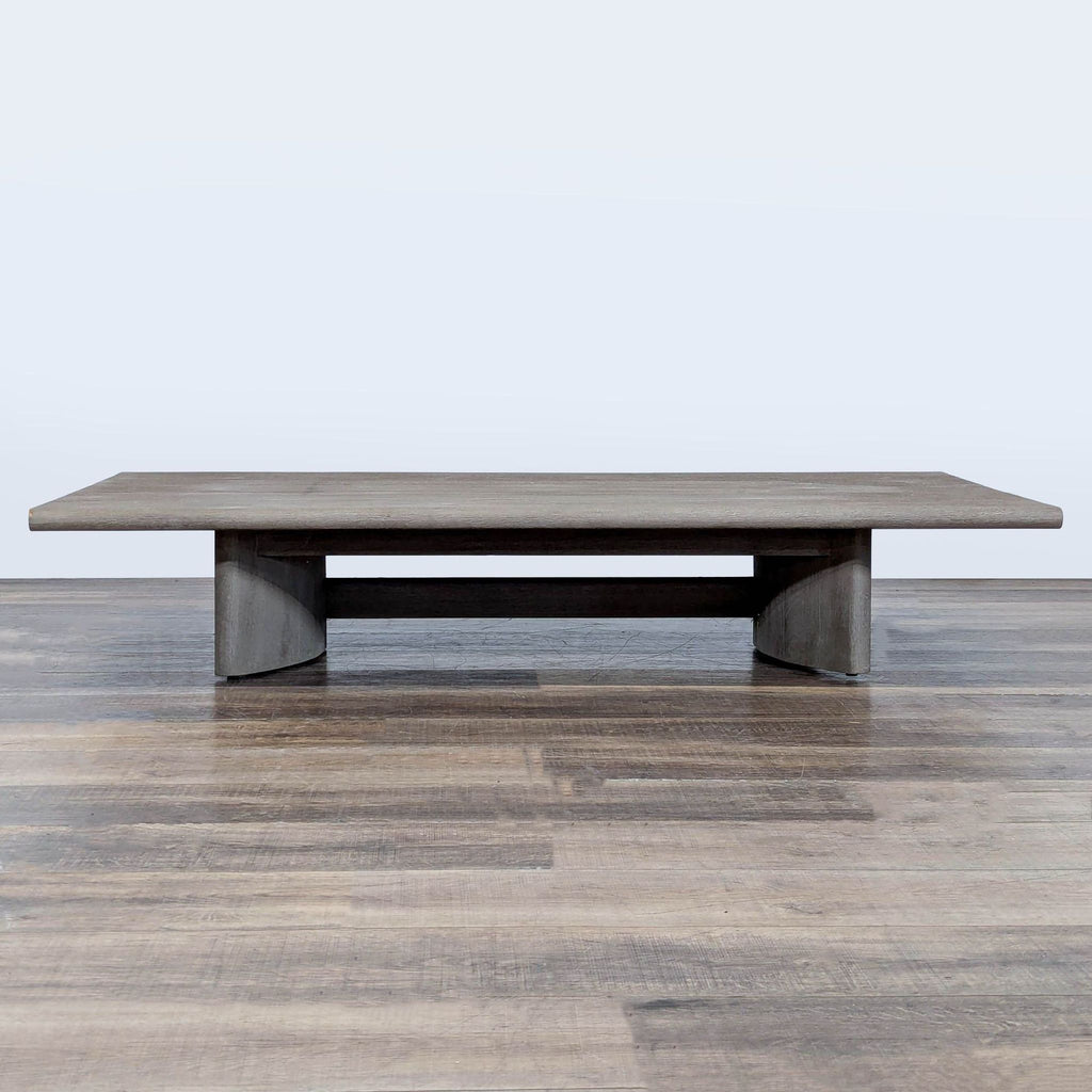 1. Weathered teak coffee table with a slat top and sculptured curved legs from Restoration Hardware.