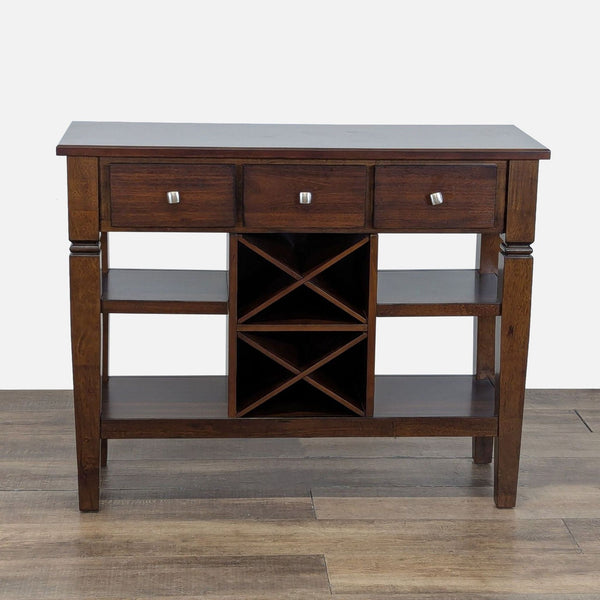 1. Dark wood sideboard from Rooms To Go with three drawers, four shelves, and wine racks, shown head-on.